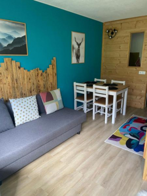 Studio mongie aux pieds des pistes avec balcon